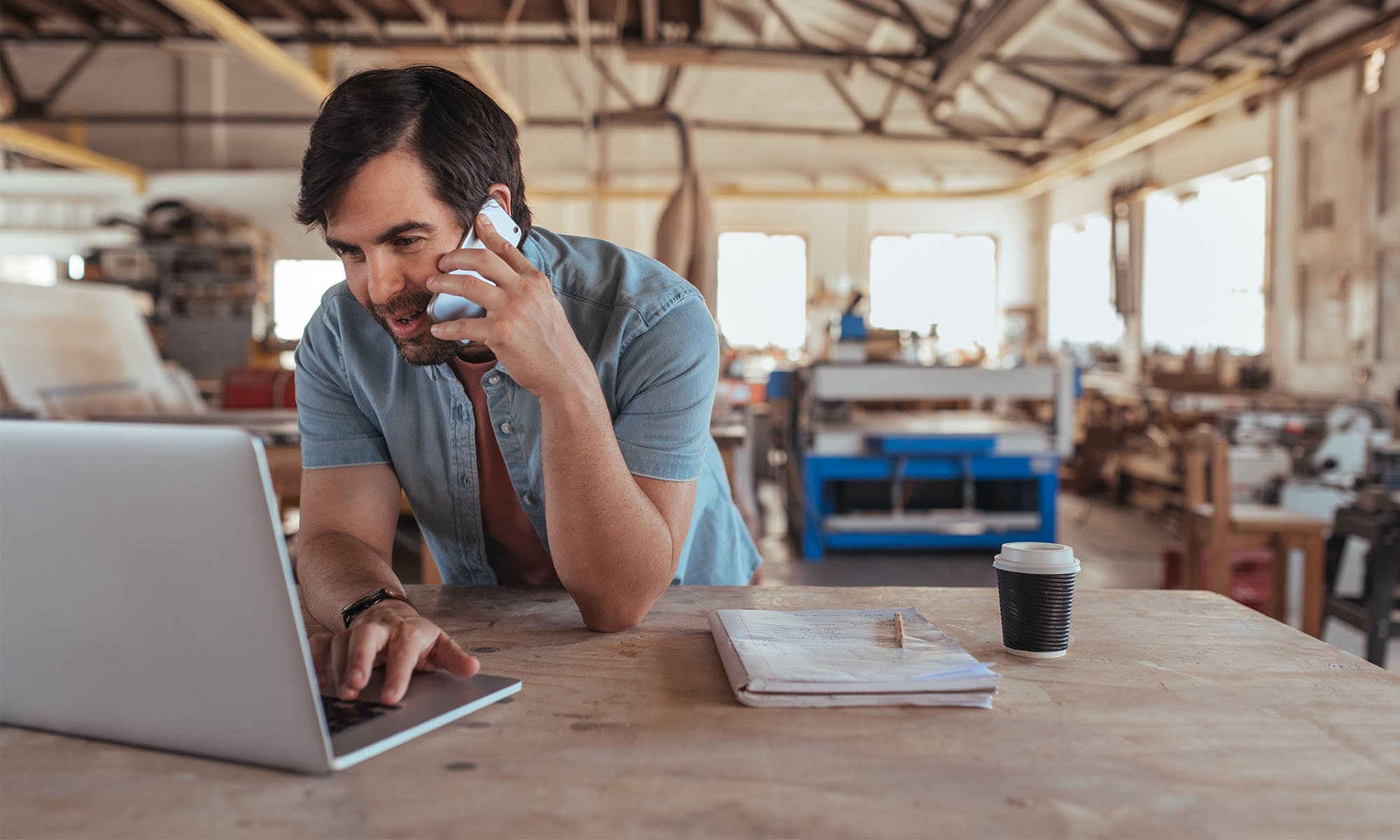 business owner on the phone in warehouse